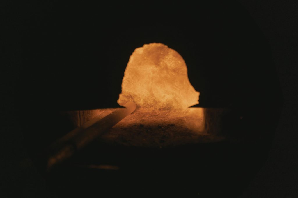 Close-up view of a blacksmith's forge, showcasing the fiery interior and intense heat.